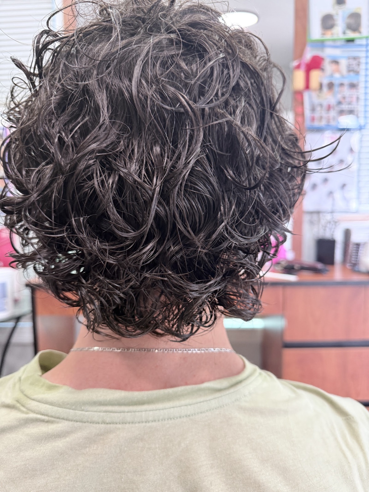 Soft perm with loose curls at Simple Cuts Framingham by Hannah, MA